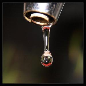 image of drop of water leaking from tap